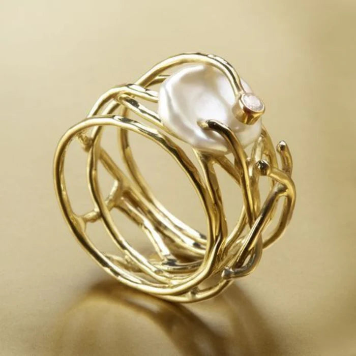 Thin gold and pearl ring in vintage style