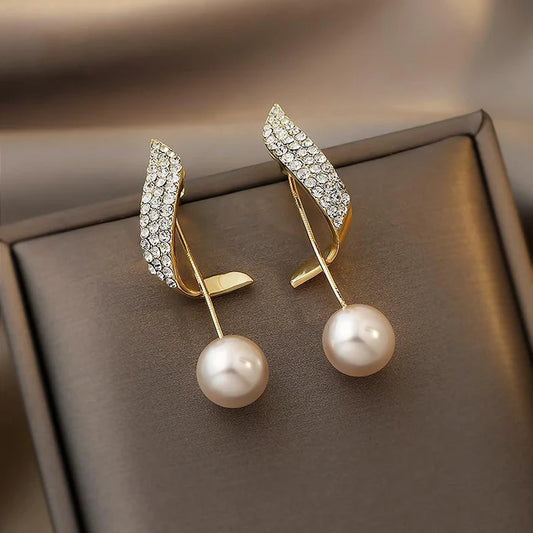 pearl earrings in gold