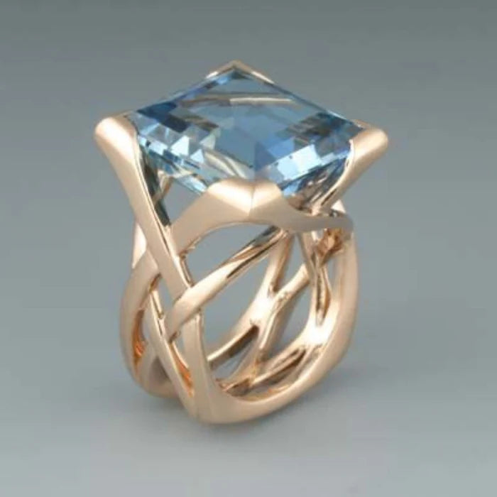 ring with blue zirconia in rose gold